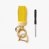 Yellow leather keychain and metal tool