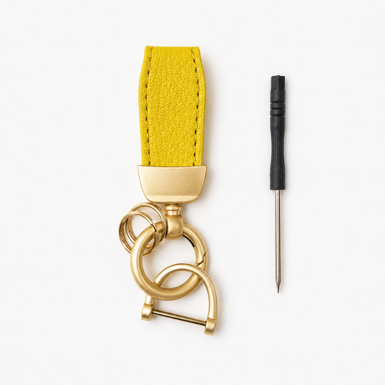 Yellow leather keychain and metal tool